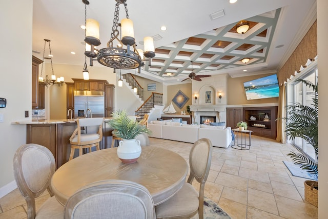 671 Indian River Dr, Melbourne, FL 32935 - dining area featuring a chandelier, a ceiling fan, crown molding, a fireplace, and coffered ceiling