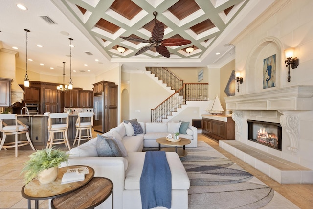 671 Indian River Dr, Melbourne, FL 32935 - living area with ornamental molding, stairway, a premium fireplace, beam ceiling, and recessed lighting