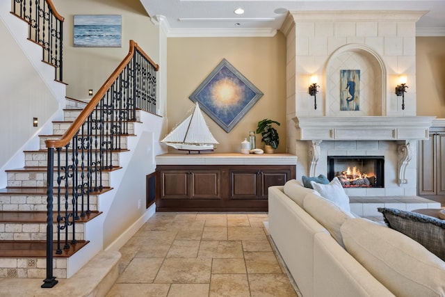 671 Indian River Dr, Melbourne, FL 32935 - stairway with crown molding, stone tile flooring, a tile fireplace, and recessed lighting