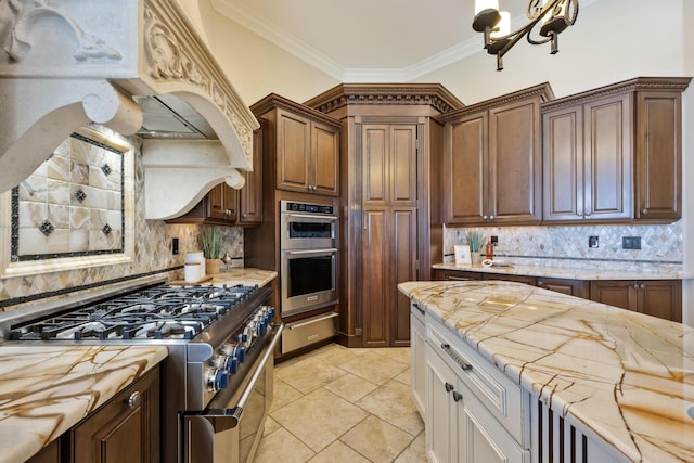 671 Indian River Dr, Melbourne, FL 32935 - kitchen with stainless steel appliances, a warming drawer, backsplash, crown molding, and a chandelier