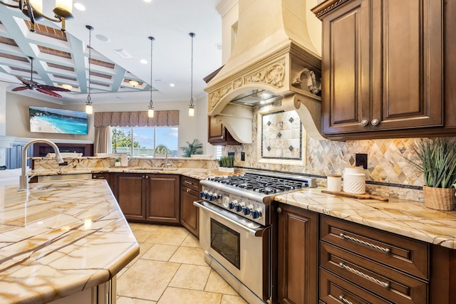 671 Indian River Dr, Melbourne, FL 32935 - kitchen with stainless steel range, tasteful backsplash, a ceiling fan, custom exhaust hood, and coffered ceiling