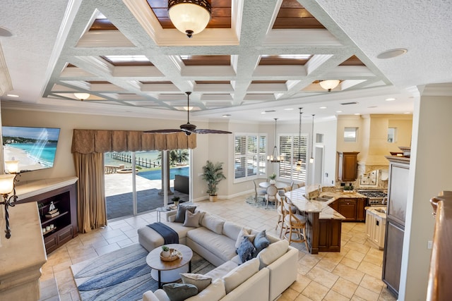 671 Indian River Dr, Melbourne, FL 32935 - living area with ornamental molding, coffered ceiling, beam ceiling, a ceiling fan, and stone tile flooring