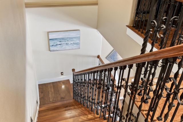 671 Indian River Dr, Melbourne, FL 32935 - staircase with wood-type flooring and baseboards