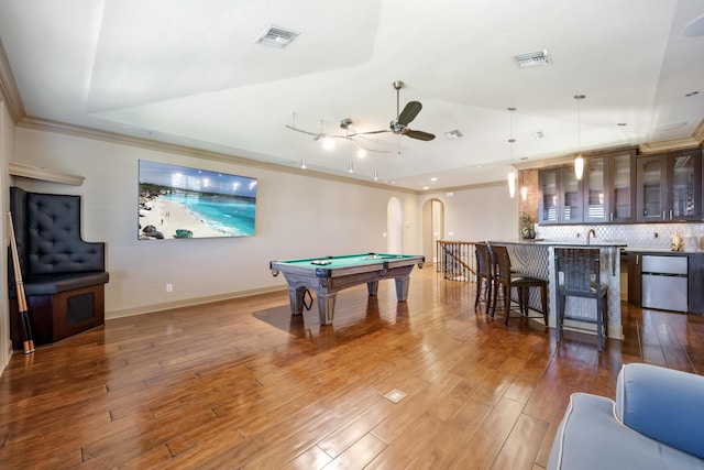 671 Indian River Dr, Melbourne, FL 32935 - game room featuring billiards, crown molding, ceiling fan, wood finished floors, and bar area