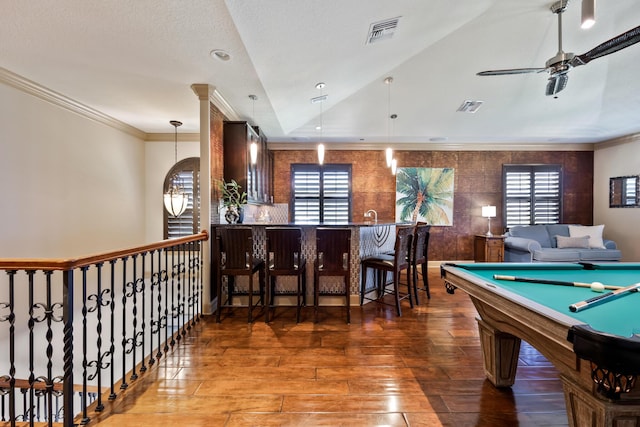 671 Indian River Dr, Melbourne, FL 32935 - playroom with wood-type flooring, ceiling fan, ornamental molding, healthy amount of natural light, and billiards table