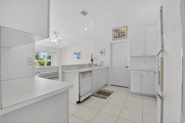 17213 Balboa Point Way, Boca Raton, FL 33487 - kitchen with dishwasher, a peninsula, vaulted ceiling, light countertops, and white cabinets