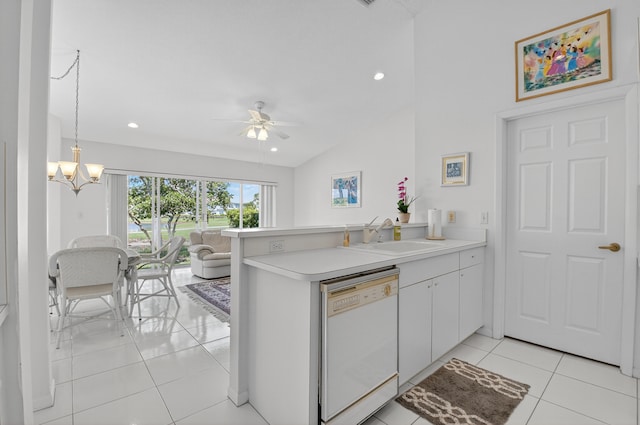 17213 Balboa Point Way, Boca Raton, FL 33487 - kitchen with dishwasher, light tile patterned floors, a peninsula, lofted ceiling, and light countertops