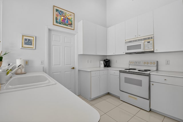 17213 Balboa Point Way, Boca Raton, FL 33487 - kitchen with white appliances, light countertops, and white cabinetry
