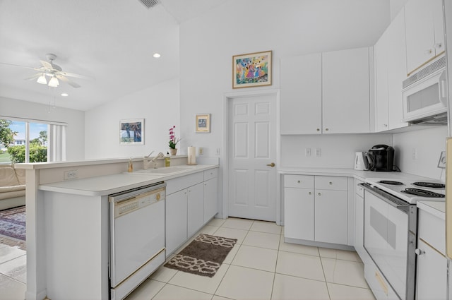 17213 Balboa Point Way, Boca Raton, FL 33487 - kitchen with white appliances, a peninsula, light countertops, a ceiling fan, and recessed lighting