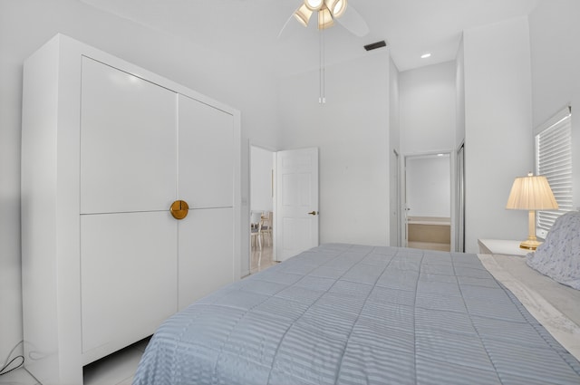 17213 Balboa Point Way, Boca Raton, FL 33487 - bedroom with ceiling fan, a closet, and a towering ceiling