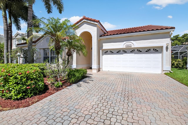 17213 Balboa Point Way, Boca Raton, FL 33487 - mediterranean / spanish house with stucco siding, decorative driveway, a garage, and a tile roof
