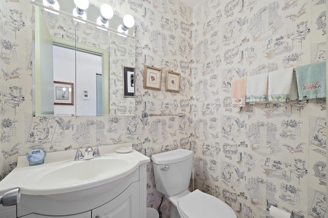 2800 Indian River Blvd Unit 7T, Vero Beach, FL 32960 - bathroom with vanity and wallpapered walls