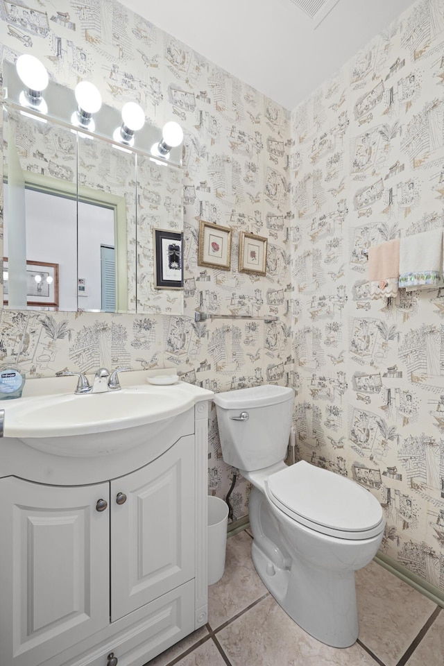 2800 Indian River Blvd Unit 7T, Vero Beach, FL 32960 - half bathroom with vanity, wallpapered walls, and tile patterned floors