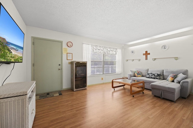2800 Indian River Blvd Unit 7T, Vero Beach, FL 32960 - living area with light wood-style floors and a textured ceiling