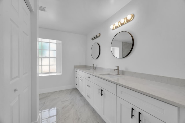 2432 SE Floresta Dr, Port Saint Lucie, FL 34984 - bathroom with double vanity and marble finish flooring