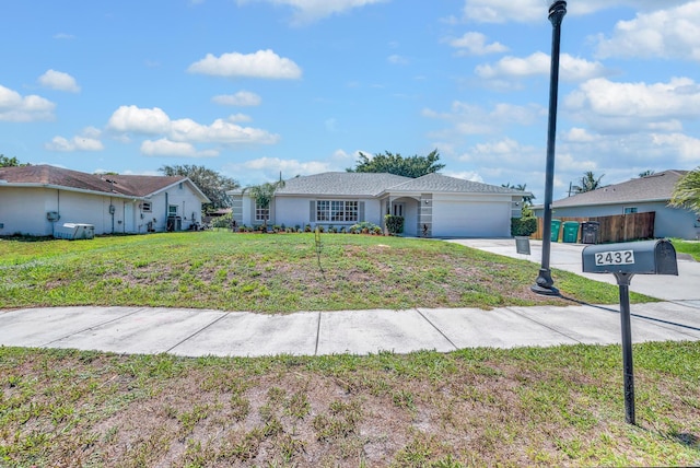 2432 SE Floresta Dr, Port Saint Lucie, FL 34984 - single story home with a garage, concrete driveway, and a front lawn