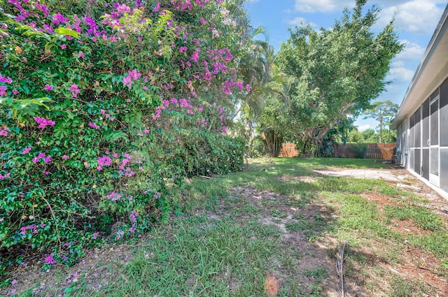 2432 SE Floresta Dr, Port Saint Lucie, FL 34984 - fenced backyard featuring a sunroom