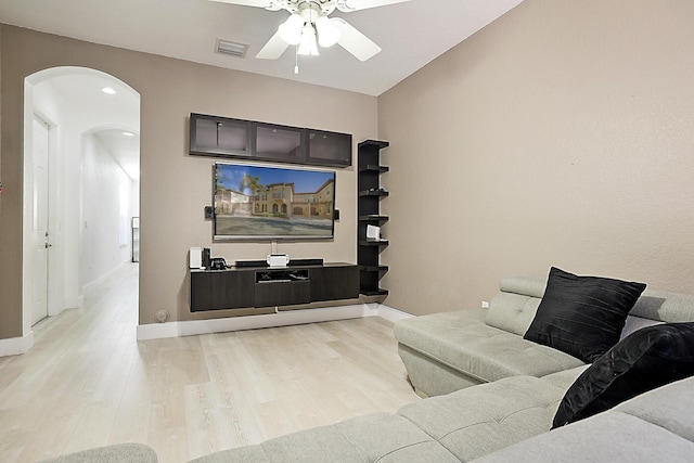 6964 Julia Gardens Dr, Coconut Creek, FL 33073 - living room with arched walkways, ceiling fan, light wood finished floors, and recessed lighting