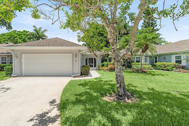 420 Hawthorne Ln, Vero Beach, FL 32962 - ranch-style house featuring a garage, concrete driveway, and a front lawn