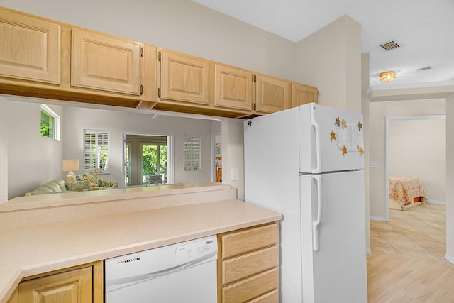 420 Hawthorne Ln, Vero Beach, FL 32962 - kitchen with white appliances, light brown cabinets, light countertops, and open floor plan
