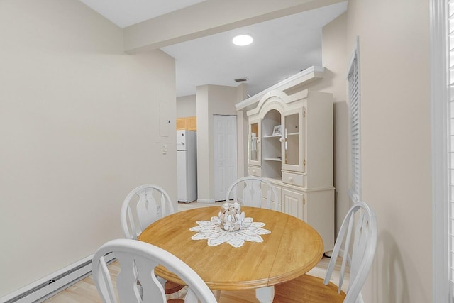 420 Hawthorne Ln, Vero Beach, FL 32962 - dining space with a baseboard heating unit and light wood-style flooring