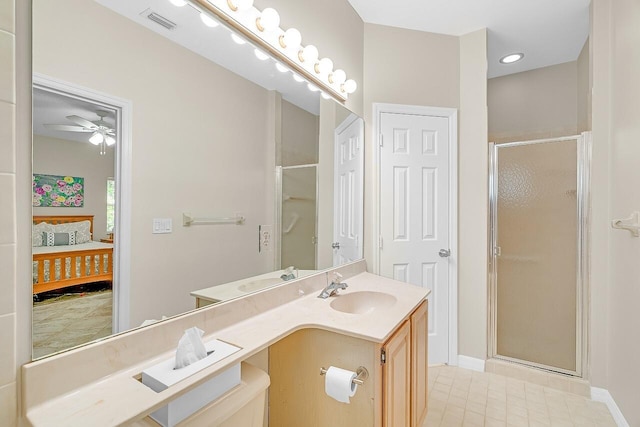 420 Hawthorne Ln, Vero Beach, FL 32962 - full bath with ensuite bath, a shower stall, a ceiling fan, vanity, and tile patterned flooring