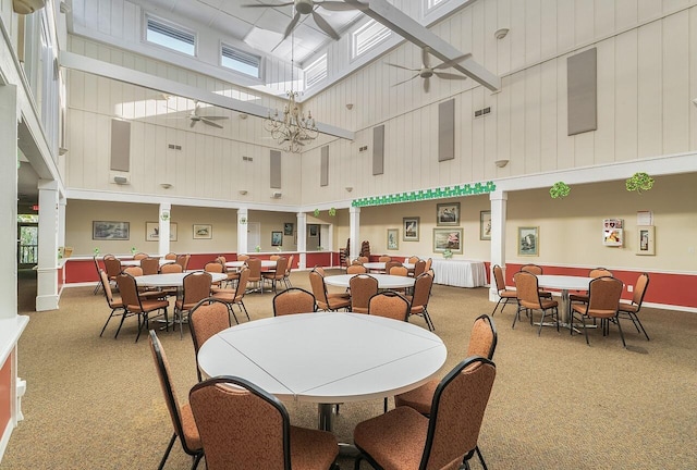 420 Hawthorne Ln, Vero Beach, FL 32962 - dining space featuring a towering ceiling, a ceiling fan, and light carpet