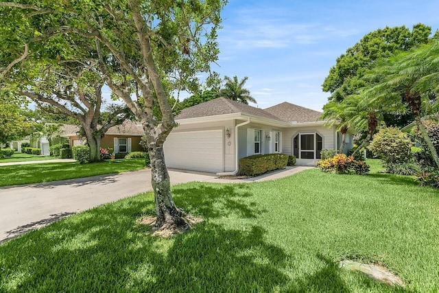 420 Hawthorne Ln, Vero Beach, FL 32962 - single story home featuring an attached garage, driveway, a front lawn, and roof with shingles