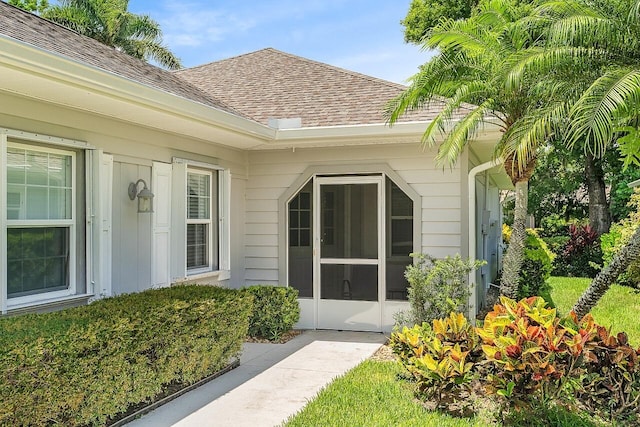 420 Hawthorne Ln, Vero Beach, FL 32962 - property entrance with a shingled roof