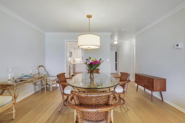 300 Intracoastal Pl Unit 204, Jupiter, FL 33469 - dining space featuring light wood-type flooring and crown molding