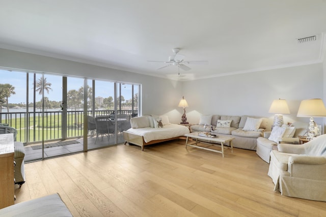 300 Intracoastal Pl Unit 204, Jupiter, FL 33469 - living area featuring ceiling fan, ornamental molding, light wood-style floors, and a water view