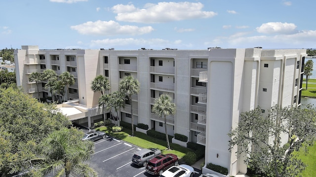 300 Intracoastal Pl Unit 204, Jupiter, FL 33469 - view of apartment building / complex featuring uncovered parking