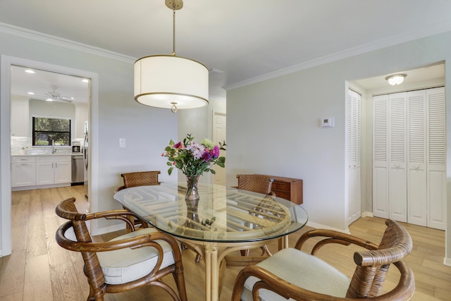 300 Intracoastal Pl Unit 204, Jupiter, FL 33469 - dining area featuring light wood-type flooring, ornamental molding, and ceiling fan