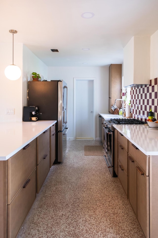 2931 SE Morningside Blvd, Port Saint Lucie, FL 34952 - kitchen featuring stainless steel appliances, backsplash, light countertops, dark speckled floor, and pendant lighting