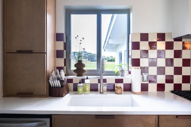 2931 SE Morningside Blvd, Port Saint Lucie, FL 34952 - kitchen with stainless steel dishwasher, backsplash, and light countertops