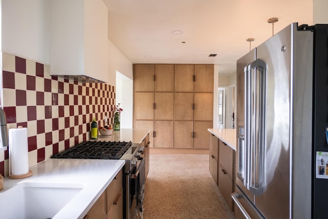 2931 SE Morningside Blvd, Port Saint Lucie, FL 34952 - kitchen featuring appliances with stainless steel finishes, light countertops, light carpet, and brown cabinets