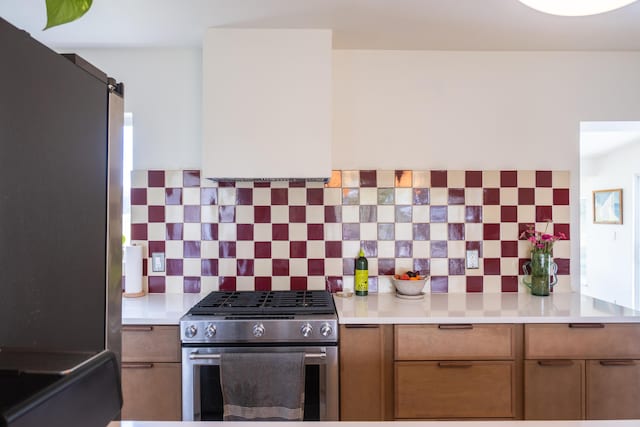 2931 SE Morningside Blvd, Port Saint Lucie, FL 34952 - kitchen with appliances with stainless steel finishes, backsplash, and light countertops