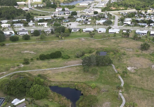 2931 SE Morningside Blvd, Port Saint Lucie, FL 34952 - aerial view of property and surrounding area featuring a large body of water and nearby suburban area