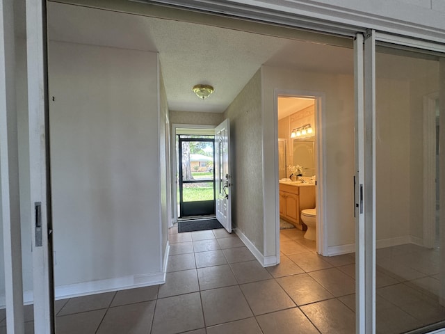 3216 59th Ave, Vero Beach, FL 32966 - hallway featuring baseboards and tile patterned floors
