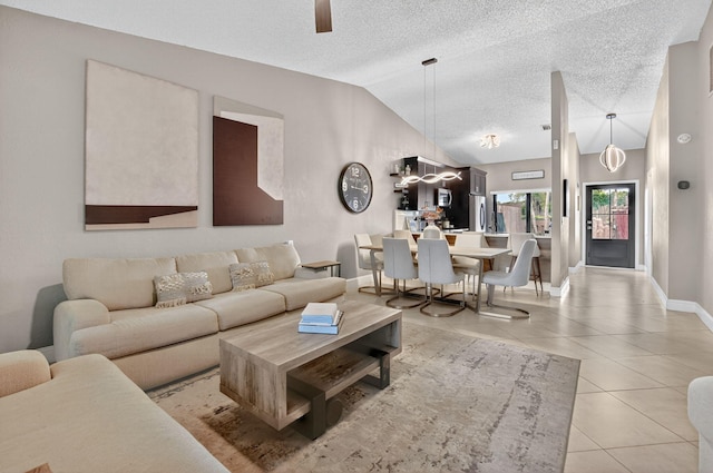 1005 NW 53rd St, Deerfield Beach, FL 33064 - living room with vaulted ceiling, ceiling fan, light tile patterned floors, and a textured ceiling