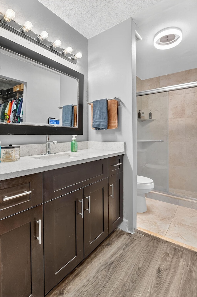 1005 NW 53rd St, Deerfield Beach, FL 33064 - full bath featuring vanity, a shower stall, wood finished floors, and a walk in closet