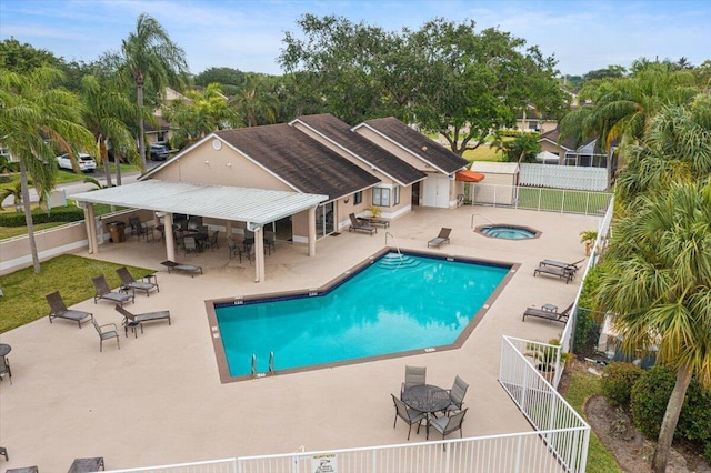 1005 NW 53rd St, Deerfield Beach, FL 33064 - community pool featuring a hot tub, a patio area, and a fenced backyard