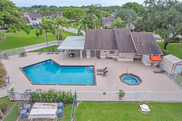 1005 NW 53rd St, Deerfield Beach, FL 33064 - community pool featuring a community hot tub, a patio, and a fenced backyard