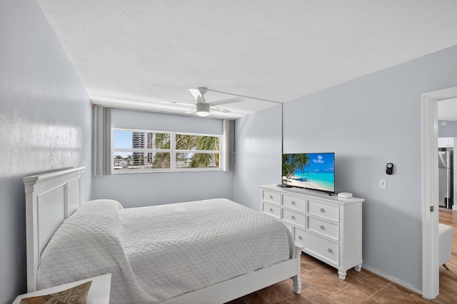 28 Yacht Club Dr Unit 409, North Palm Beach, FL 33408 - bedroom featuring baseboards and a ceiling fan