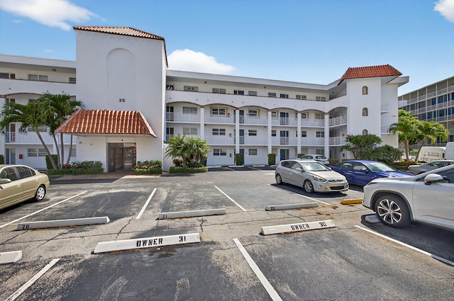 28 Yacht Club Dr Unit 409, North Palm Beach, FL 33408 - view of apartment building / complex with uncovered parking