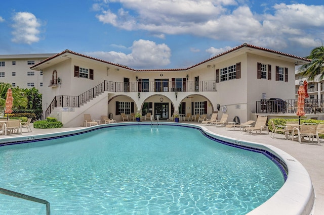 28 Yacht Club Dr Unit 409, North Palm Beach, FL 33408 - community pool with a patio area and stairs