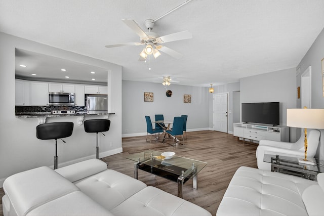 28 Yacht Club Dr Unit 409, North Palm Beach, FL 33408 - living area featuring ceiling fan, wood finished floors, and recessed lighting