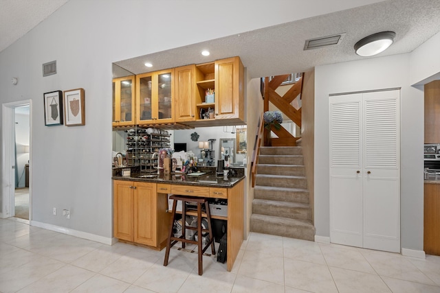 3809 Island Club Cir E, Lake Worth, FL 33462 - indoor wet bar featuring stairway, light tile patterned floors, a textured ceiling, recessed lighting, and high vaulted ceiling
