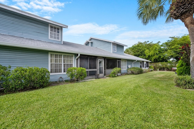 3809 Island Club Cir E, Lake Worth, FL 33462 - traditional-style home featuring a front lawn and a sunroom