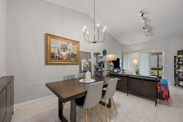 3809 Island Club Cir E, Lake Worth, FL 33462 - dining room featuring a chandelier, light tile patterned floors, high vaulted ceiling, and track lighting